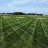 Rick's Quality Mowing Service logo