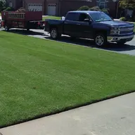 TnT Lawn Service - Tom and Todd Godwin logo
