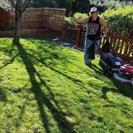 Grassbusters - We Mow Grass Cheap! logo