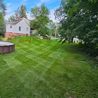Blowin Grass Lawn And Landscaping llc logo