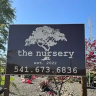 Professional Landscape and Irrigation and the nursery logo
