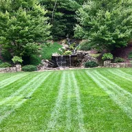 Justus Lawn Care logo